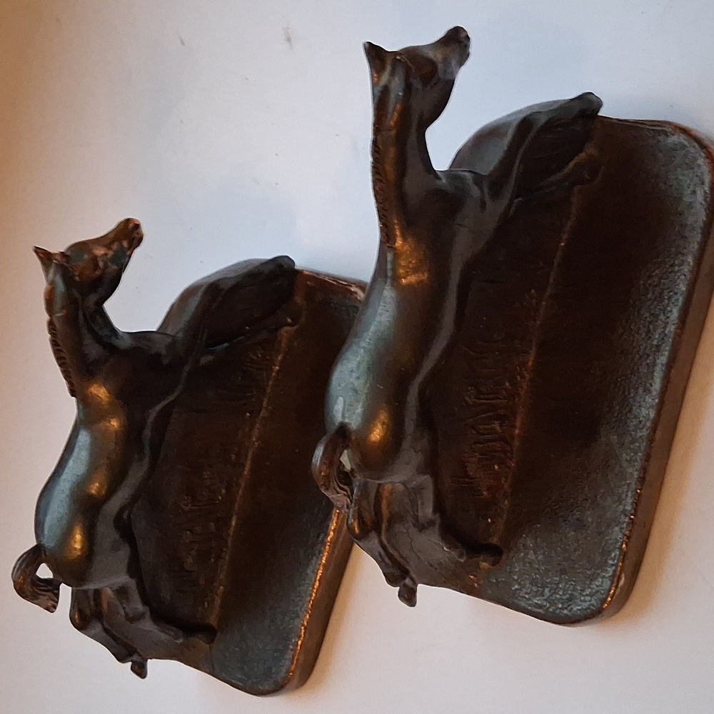 Vintage pair of Dodge Inc. cast metal Western Horse Bookends